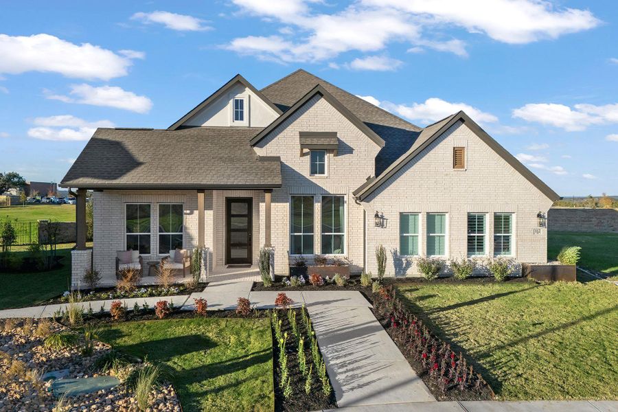 Front exterior of a new home in Parmer Ranch, Georgetown, TX, highlighting curb appeal (Image 2). Front exterior of a new home in Parmer Ranch, Georgetown, TX, highlighting curb appeal (Image 2).