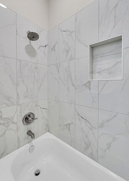 Full bathroom with bathing tub / shower combination