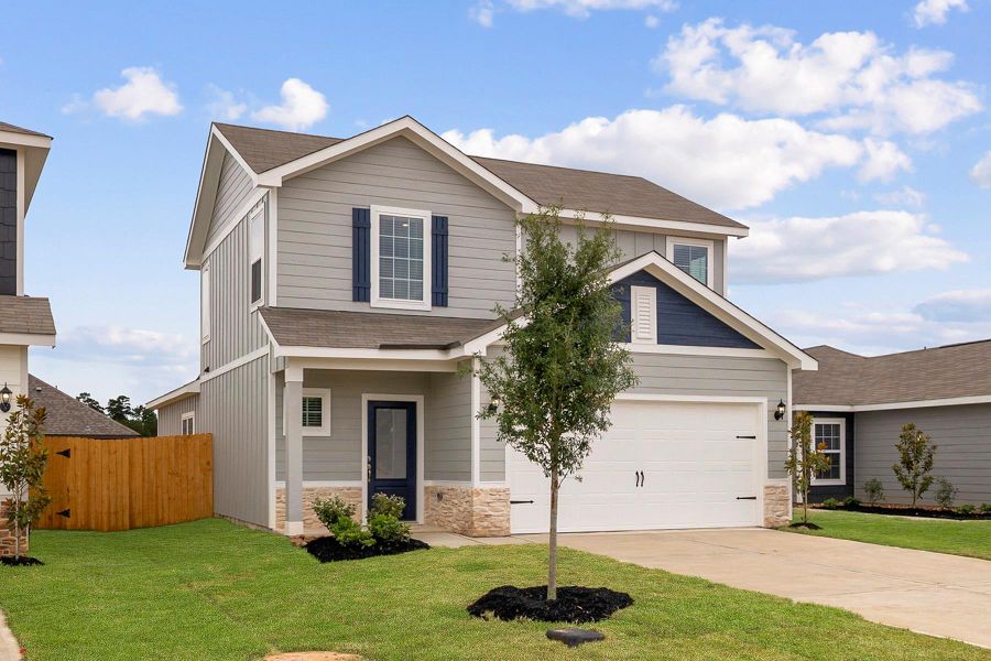 Front exterior of a new home in Magnolia Woods, Magnolia, TX, highlighting curb appeal (Image 1). Front exterior of a new home in Magnolia Woods, Magnolia, TX, highlighting curb appeal (Image 1).