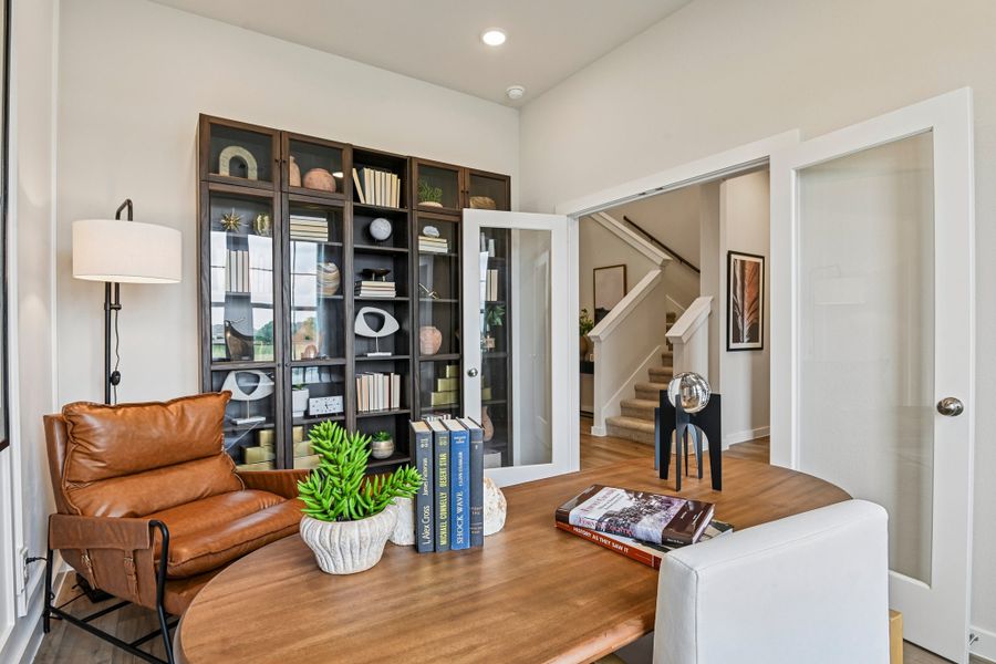 A living room with a glass door.
