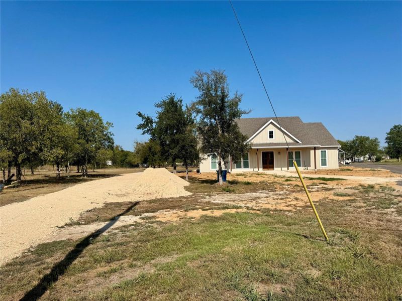 View of front of home featuring a porch and a front lawn View of front of home featuring a porch and a front lawn