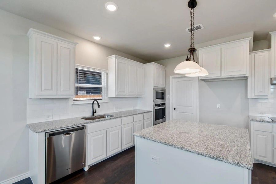 Kitchen | Concept 2393 at Lovers Landing in Forney, TX by Landsea Homes