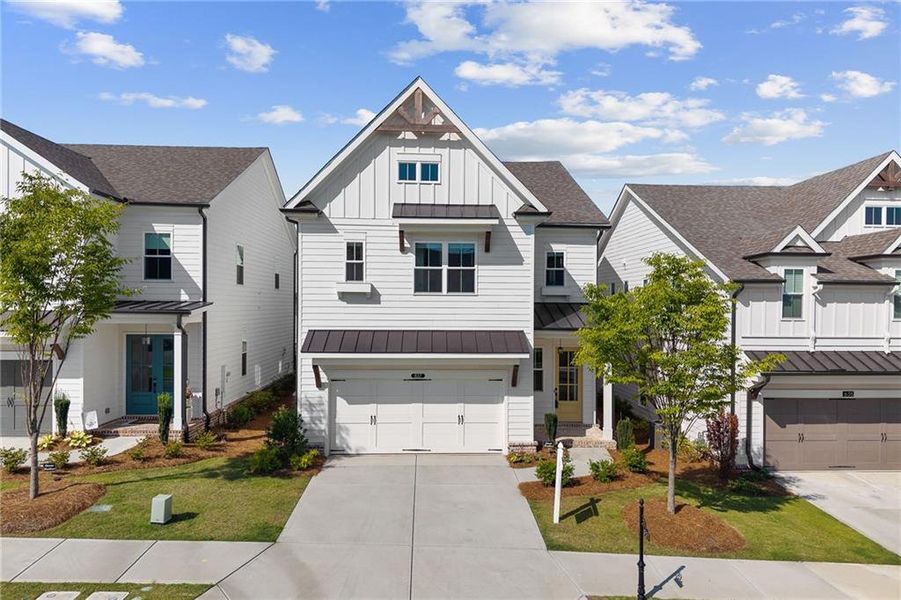 Front exterior of a new home in Palisades Single Family, Cumming, GA, highlighting curb appeal (Image 27). Front exterior of a new home in Palisades Single Family, Cumming, GA, highlighting curb appeal (Image 27).