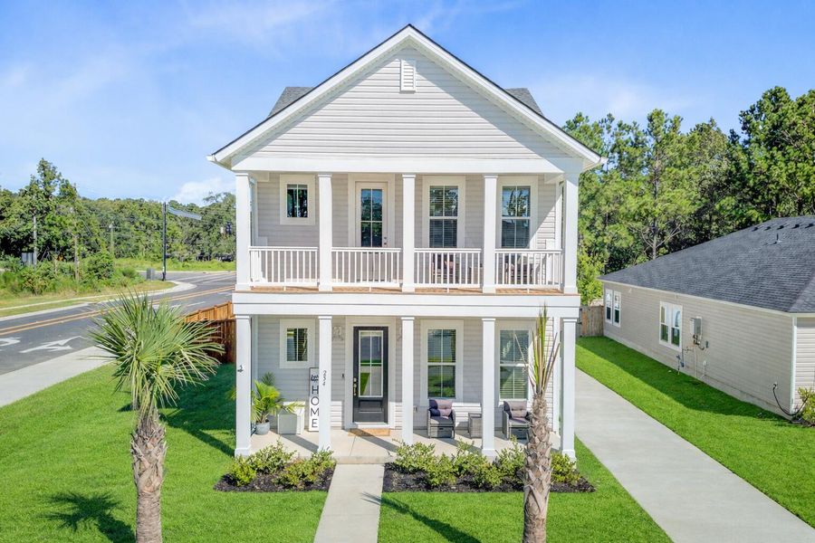 Front exterior of a new home in Limehouse Village: Row Collection, Summerville, SC, highlighting curb appeal (Image 2).