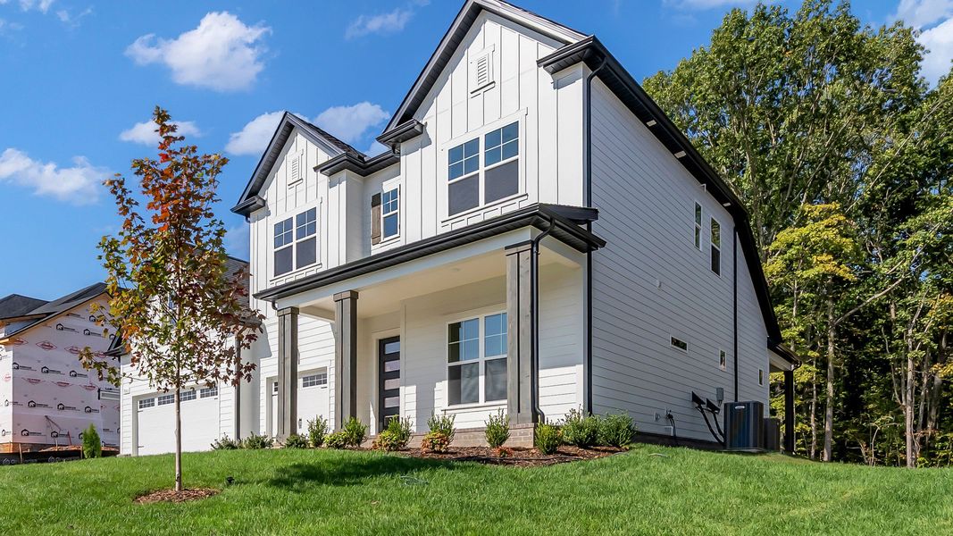 Front exterior of a new home in Brush Creek, Fairview, TN, highlighting curb appeal (Image 2). Front exterior of a new home in Brush Creek, Fairview, TN, highlighting curb appeal (Image 2).