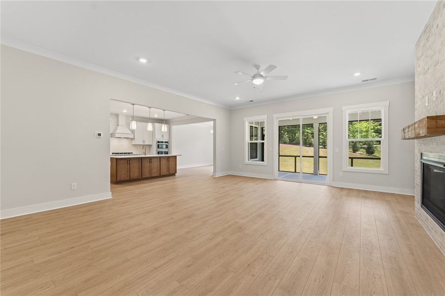 An open floor plan with hardwood floors transition