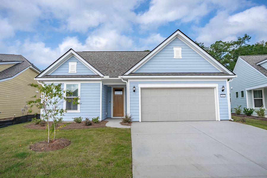 Front exterior of a new home in Del Webb Charleston at Nexton, Summerville, SC, highlighting curb appeal (Image 2). Front exterior of a new home in Del Webb Charleston at Nexton, Summerville, SC, highlighting curb appeal (Image 2).