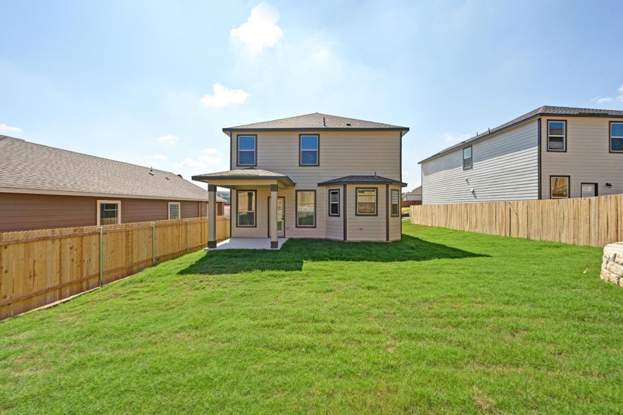 Exterior details and patio area of a home in Creekside at Estancia, Austin (Image 22).