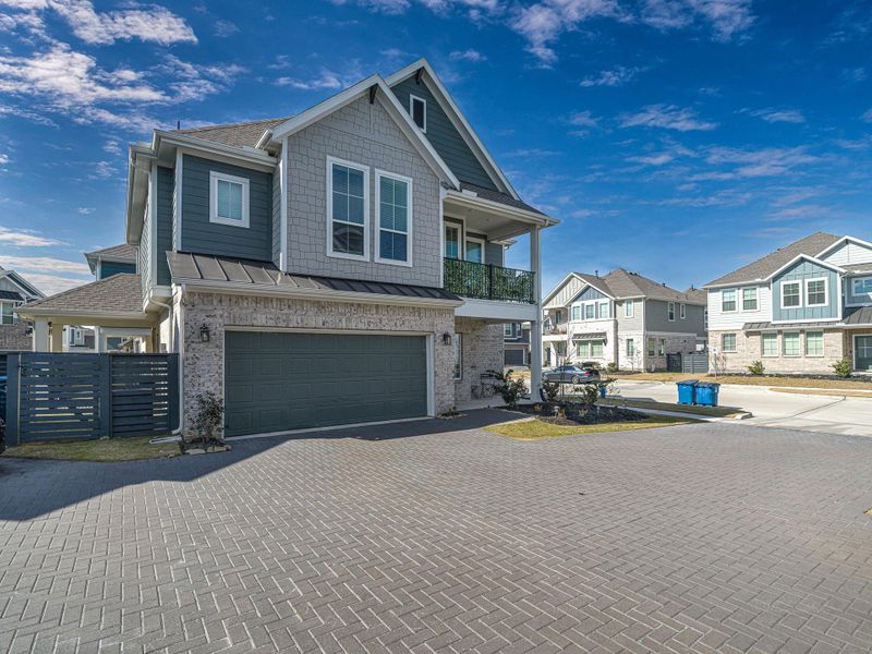 Front exterior of a new home in Bridgeland, Cypress, TX, highlighting curb appeal (Image 1). Front exterior of a new home in Bridgeland, Cypress, TX, highlighting curb appeal (Image 1).