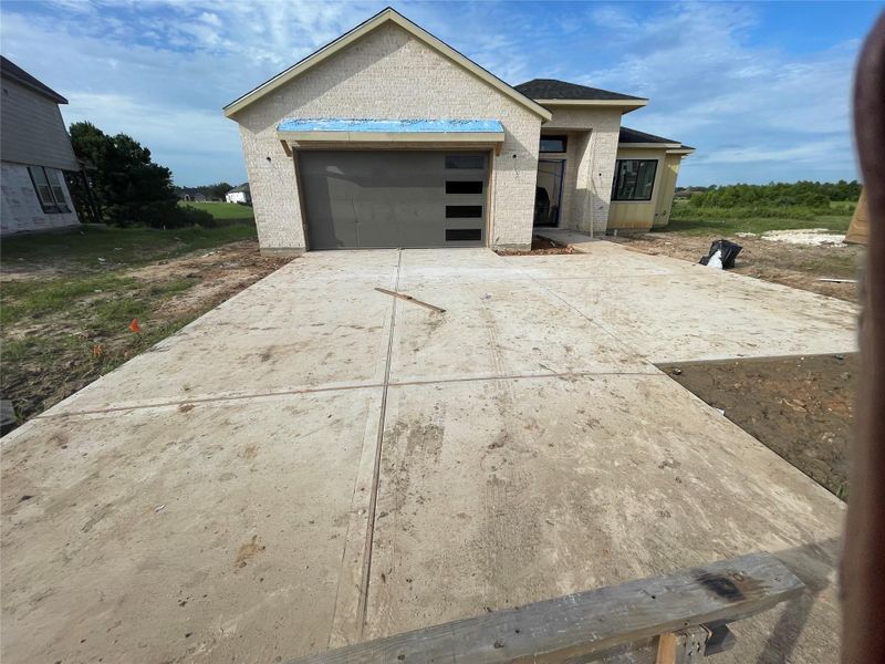 Front exterior of a new home in , Montgomery, TX, highlighting curb appeal (Image 28). Front exterior of a new home in , Montgomery, TX, highlighting curb appeal (Image 28).