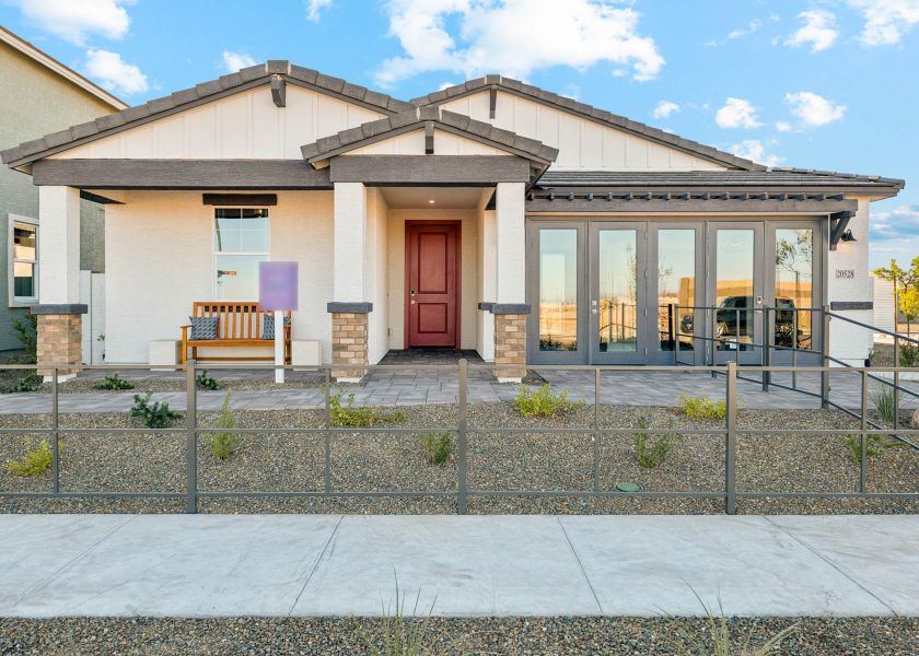 A house with a fence in front. A house with a fence in front.