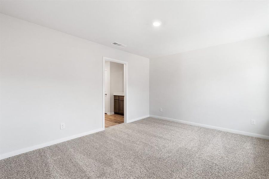 View of carpeted spare room