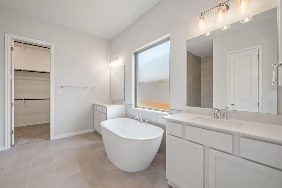 Primary Bath retreat with dual vanities & soaking tub