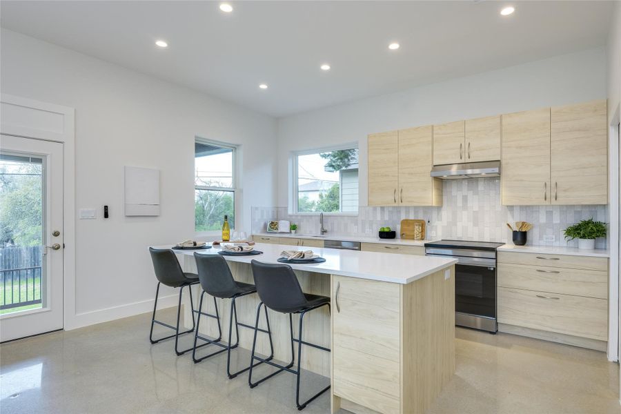 Kitchen has Carrera quartz countertops and stainless steel Energy Star appliances.