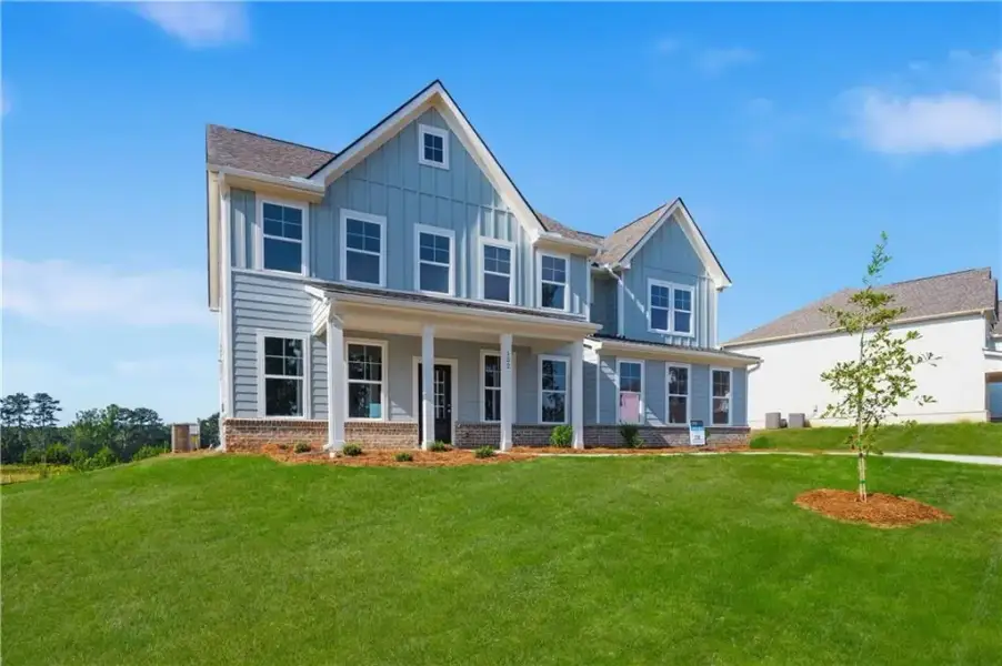 Front exterior of a new home in Brighton, Locust Grove, GA, highlighting curb appeal (Image 19).