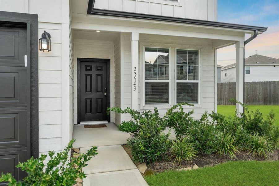 Upon arrival to this STUNNING home, elegance greets you prior to entry with a welcoming walkway to the private covered porch and mature landscaping.