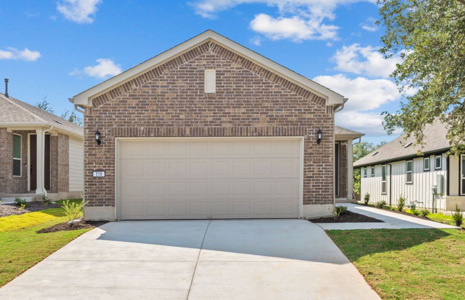 Front exterior of a new home in Sun City Texas, Georgetown, TX, highlighting curb appeal (Image 2). Front exterior of a new home in Sun City Texas, Georgetown, TX, highlighting curb appeal (Image 2).