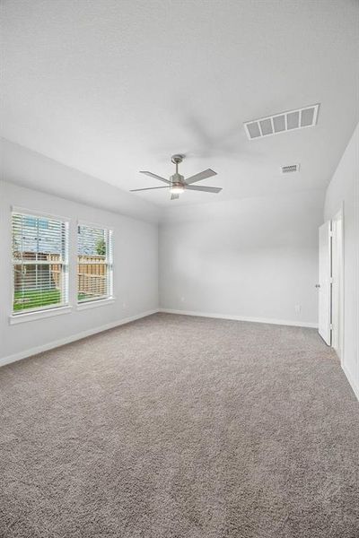 Primary Suite in the Oscar home plan by Trophy Signature Homes – REPRESENTATIVE PHOTO