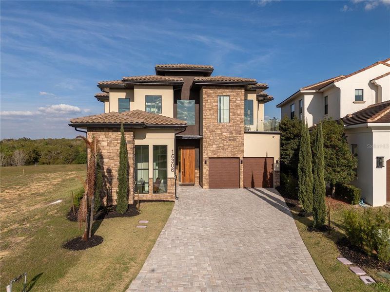 Front exterior of a new home in , Montverde, FL, highlighting curb appeal (Image 27).