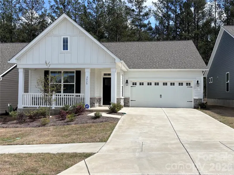 Front exterior of a new home in Westport Freedom Series, York, SC, highlighting curb appeal (Image 1). Front exterior of a new home in Westport Freedom Series, York, SC, highlighting curb appeal (Image 1).