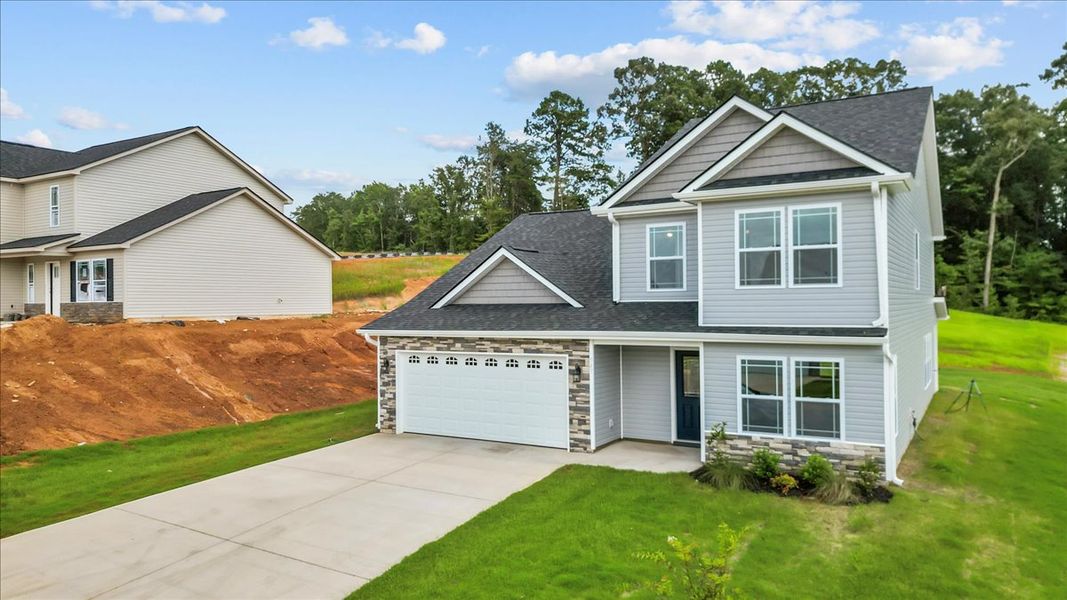 Representative exterior photo of a completed home built from the Ridge by Enchanted Homes in Lonesome Dove, San Antonio, TX (Image 19).