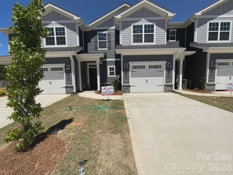 Front exterior of a new home in Pine Trace, Gastonia, NC, highlighting curb appeal (Image 2). Front exterior of a new home in Pine Trace, Gastonia, NC, highlighting curb appeal (Image 2).