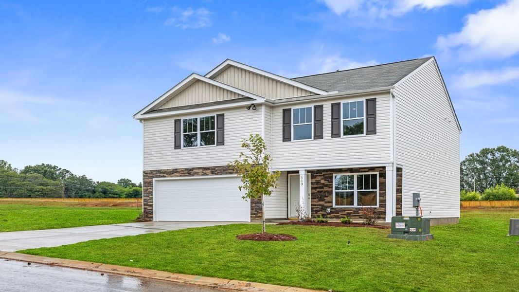 Front exterior of a new home in Bentley Park, Greenwood, SC, highlighting curb appeal (Image 2). Front exterior of a new home in Bentley Park, Greenwood, SC, highlighting curb appeal (Image 2).