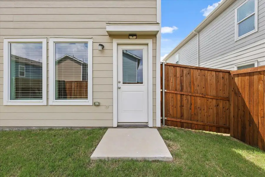 Exterior details and patio area of a home in Foree Ranch: Wellton Collection, Providence Village (Image 4).