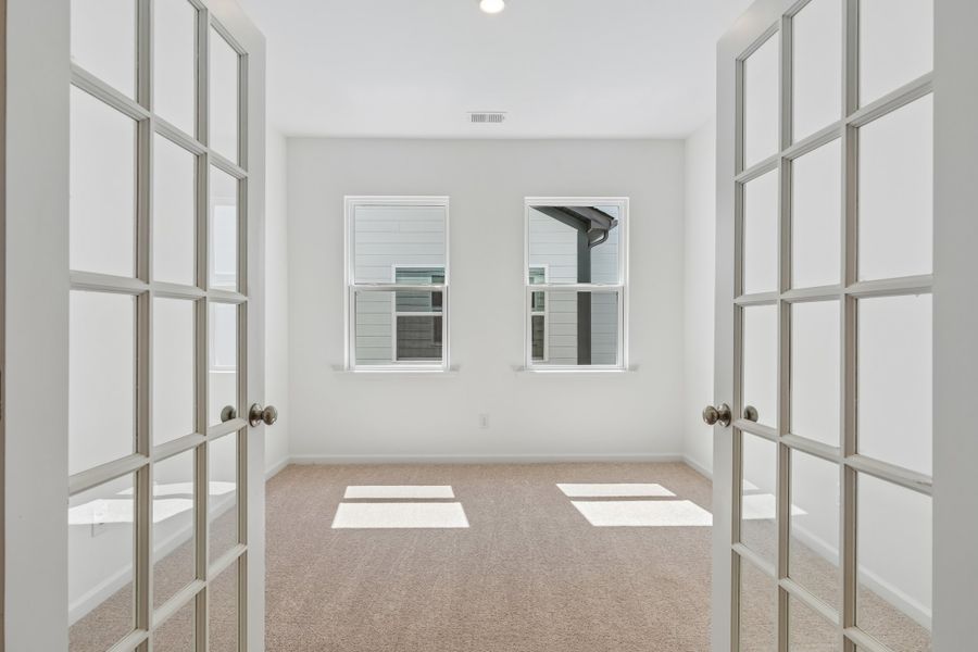 Spacious, unfurnished interior of a new home in Terraces at the Exchange, Indian Land (Image 16).