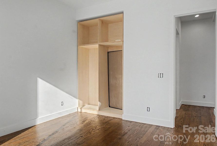 first floor bedroom with built in cabinets