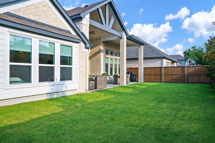 Room to Roam - The backyard offers open green space for play, pets, or quiet evenings outside—fully fenced and lined with established privacy trees. Room to Roam - The backyard offers open green space for play, pets, or quiet evenings outside—fully fenced and lined with established privacy trees.