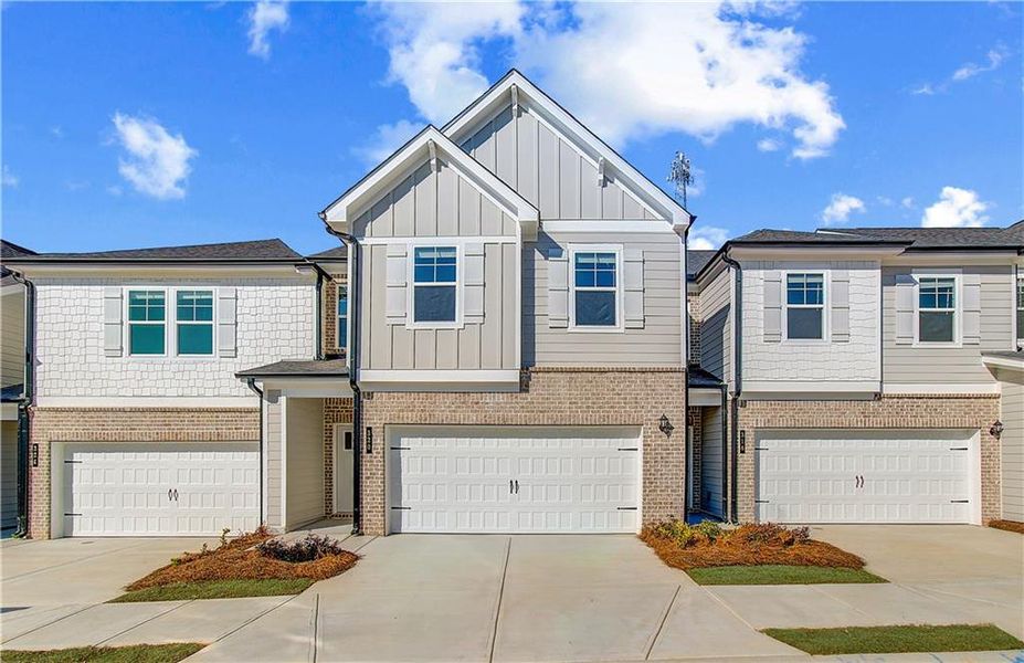 Front exterior of a new home in Diamante, Stockbridge, GA, highlighting curb appeal (Image 18). Front exterior of a new home in Diamante, Stockbridge, GA, highlighting curb appeal (Image 18).