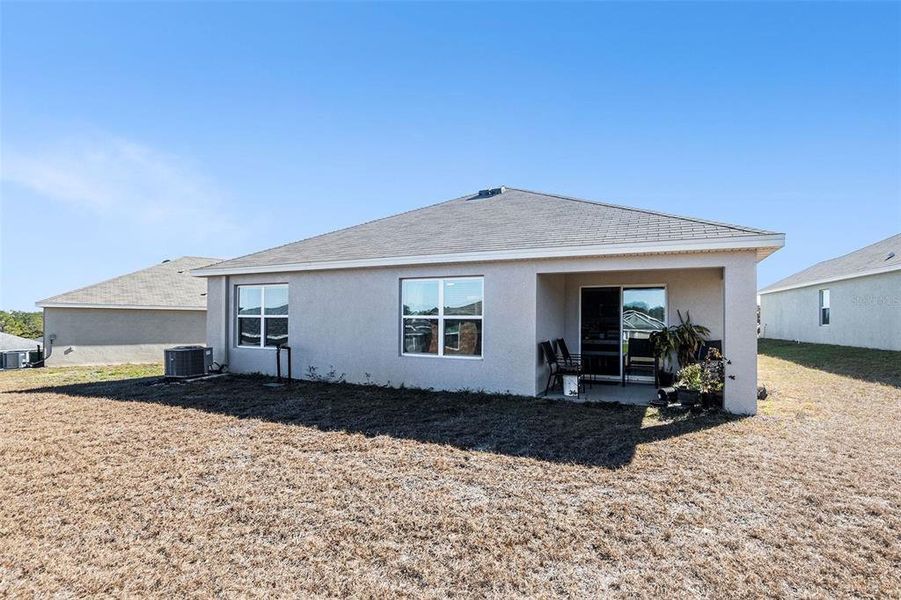 Exterior details and patio area of a home in Fairways at Twisted Oaks, Beverly Hills (Image 25).
