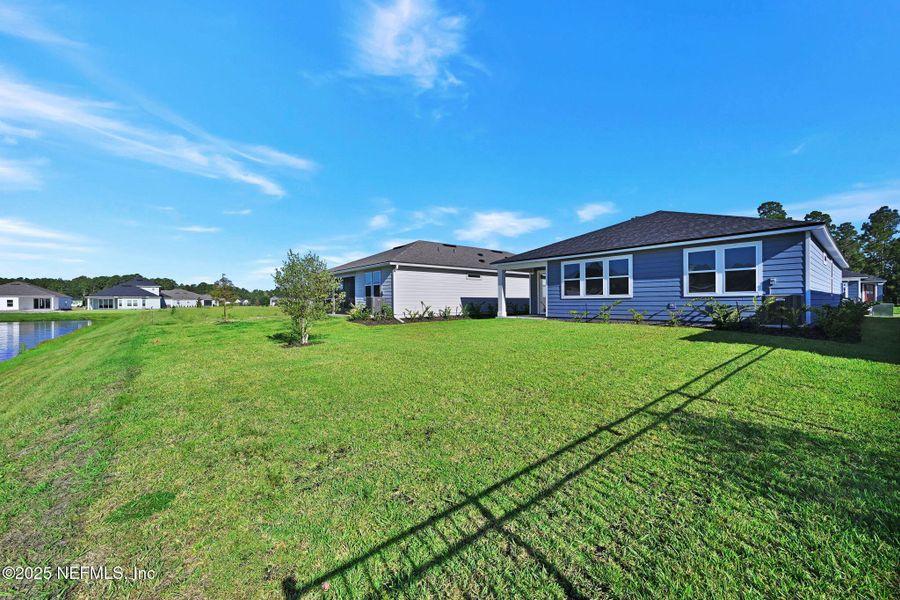 Front exterior of a new home in Hyland Trail, Green Cove Springs, FL, highlighting curb appeal (Image 19). Front exterior of a new home in Hyland Trail, Green Cove Springs, FL, highlighting curb appeal (Image 19).