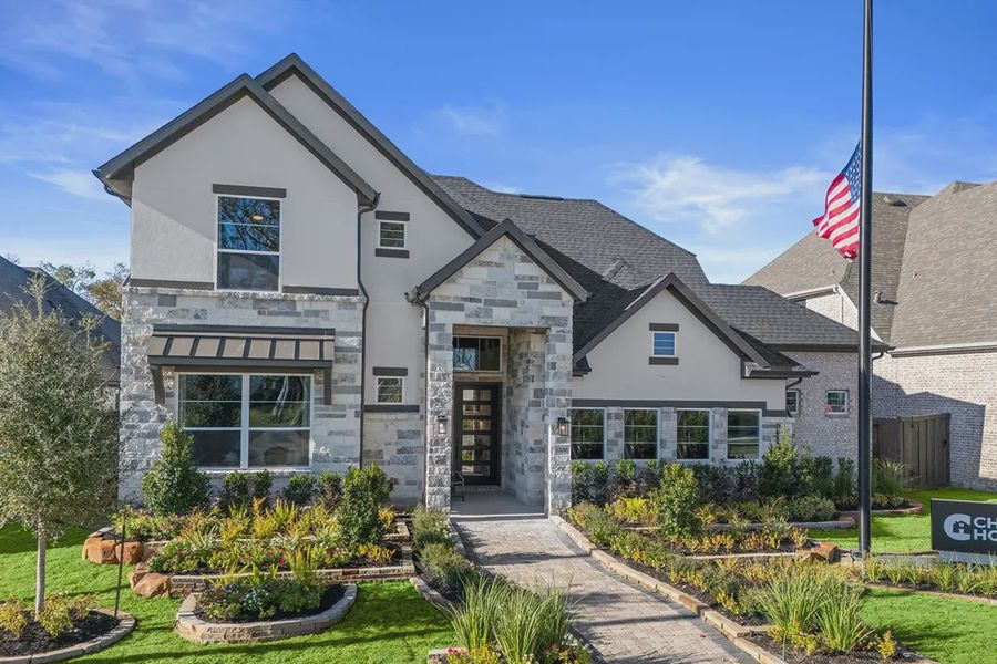 Front exterior of a new home in Riceland 60',65',70', Mont Belvieu, TX, highlighting curb appeal (Image 20). Front exterior of a new home in Riceland 60',65',70', Mont Belvieu, TX, highlighting curb appeal (Image 20).
