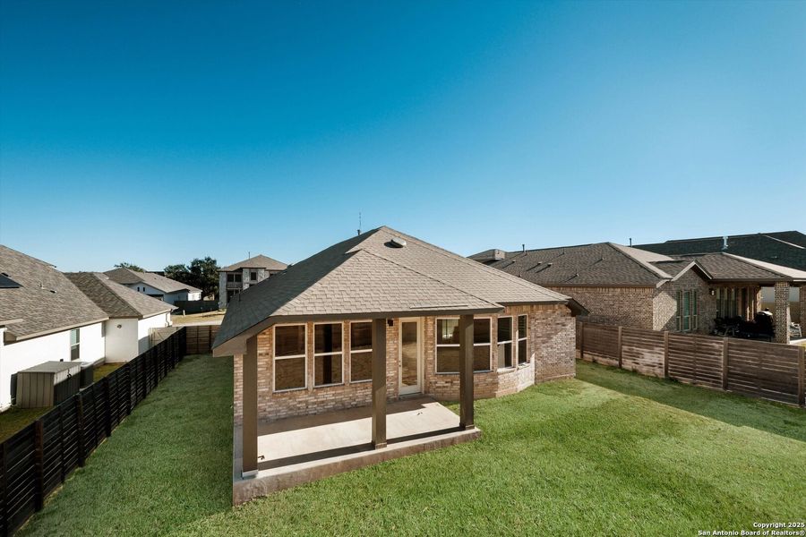 Exterior details and patio area of a home in The Grove at Vintage Oaks, New Braunfels (Image 4).