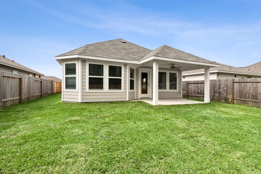 Exterior details and patio area of a home in Magnolia Ridge, Magnolia (Image 21).