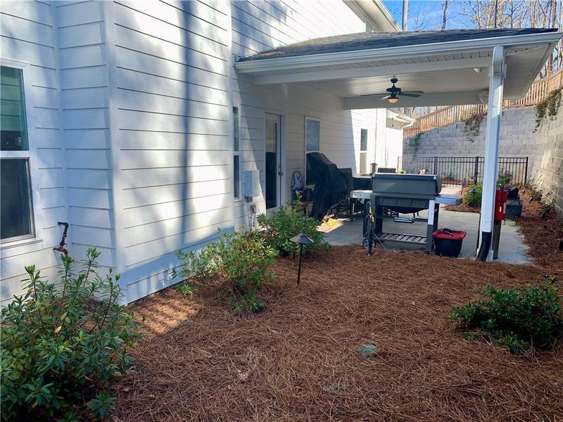 Exterior details and patio area of a home in Holiday Pines, Buford (Image 24).