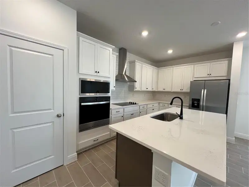 Furnished interior view inside a new home in Hills of Minneola, Minneola (Image 6).