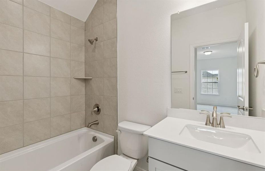 Elegant secondary bath with contemporary design  *Real home pictured