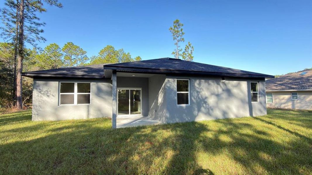 Exterior details and patio area of a home in , Citrus Springs (Image 15).