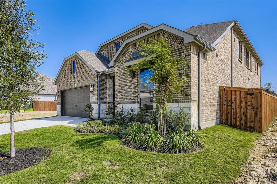 View of front of house featuring brick siding, driveway, an attached garage, and a shingled roof View of front of house featuring brick siding, driveway, an attached garage, and a shingled roof