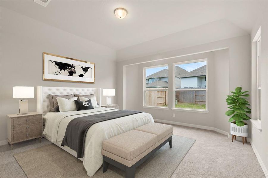 The primary bedroom is generously sized, creating a tranquil and spacious retreat that offers ample room for relaxation. Featuring plush carpet, high ceilings, fresh paint, and large windows that lets in natural lighting throughout the day.