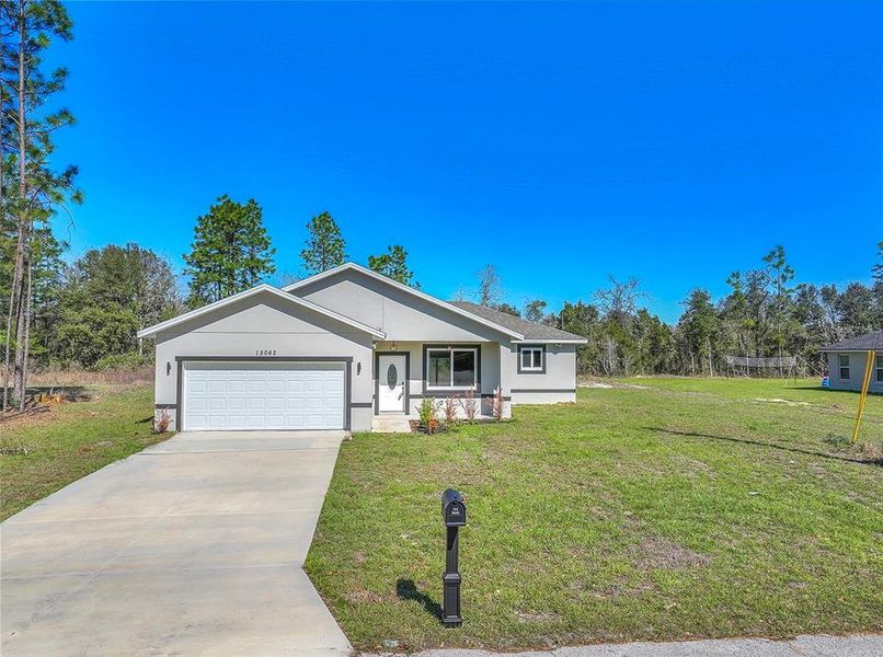 Front exterior of a new home in , Ocala, FL, highlighting curb appeal (Image 27).