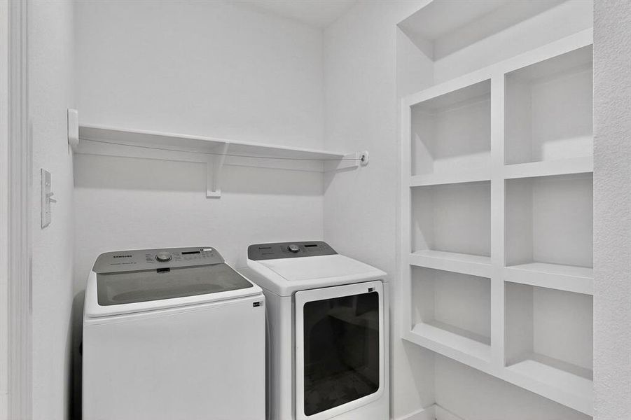 Laundry area featuring washing machine and clothes dryer Laundry area featuring washing machine and clothes dryer