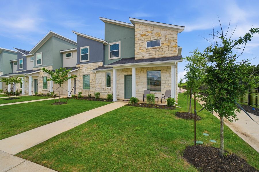 Representative exterior photo of a completed home built from the Eames by CastleRock Communities in Municipal Drive Townhomes, Leander, TX (Image 2). Representative exterior photo of a completed home built from the Eames by CastleRock Communities in Municipal Drive Townhomes, Leander, TX (Image 2).