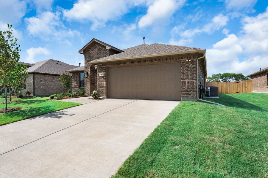 Front exterior of a new home in Fox Landing, Caddo Mills, TX, highlighting curb appeal (Image 18). Front exterior of a new home in Fox Landing, Caddo Mills, TX, highlighting curb appeal (Image 18).