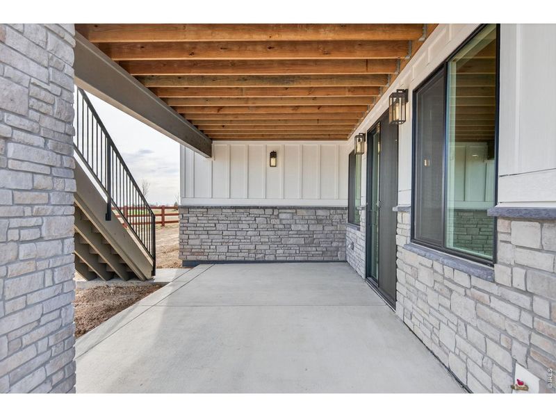 Exterior details and patio area of a home in RainDance, Windsor (Image 3).