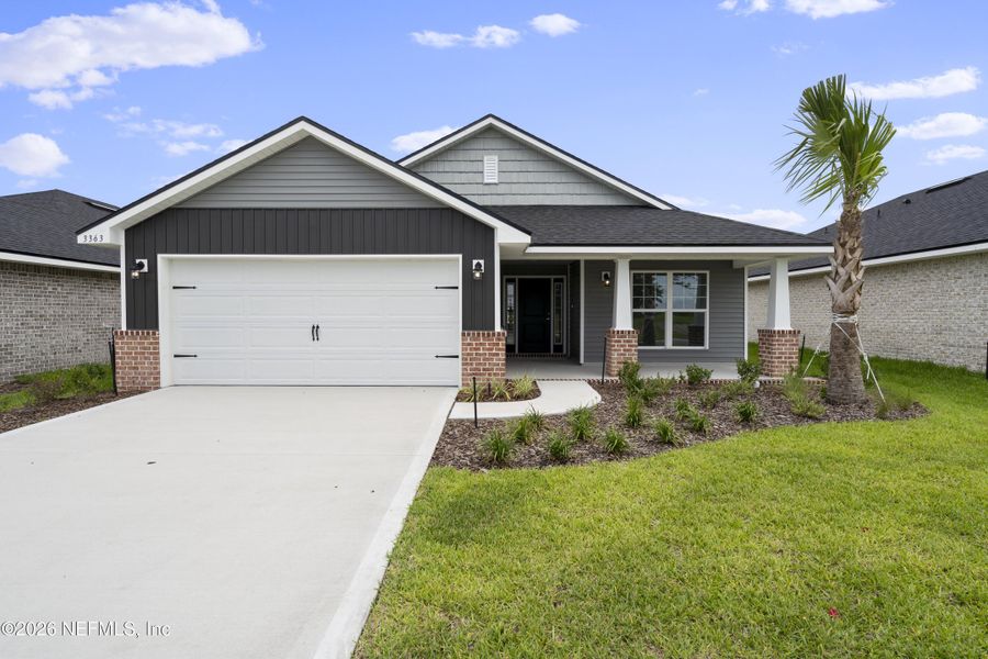 Front exterior of a new home in Shadow Crest at Rolling Hills, Green Cove Springs, FL, highlighting curb appeal (Image 1). Front exterior of a new home in Shadow Crest at Rolling Hills, Green Cove Springs, FL, highlighting curb appeal (Image 1).