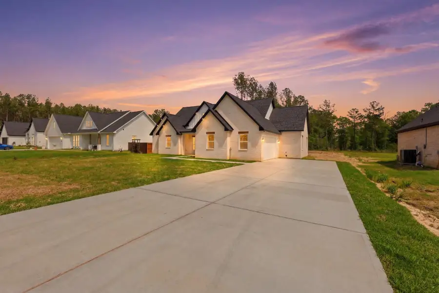 Front exterior of a new home in , Dayton, TX, highlighting curb appeal (Image 2).